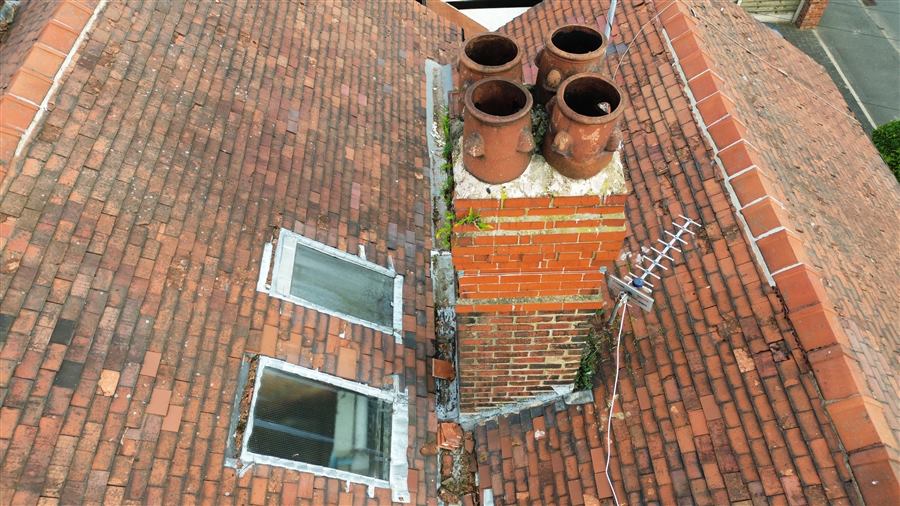 Aerial inspection of roof coverings and chimney stacks