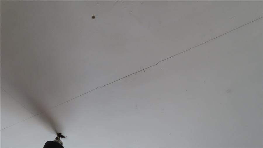 Cracking visible across an internal ceiling