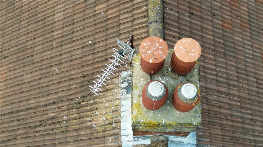 Weathered chimney pots viewed from above