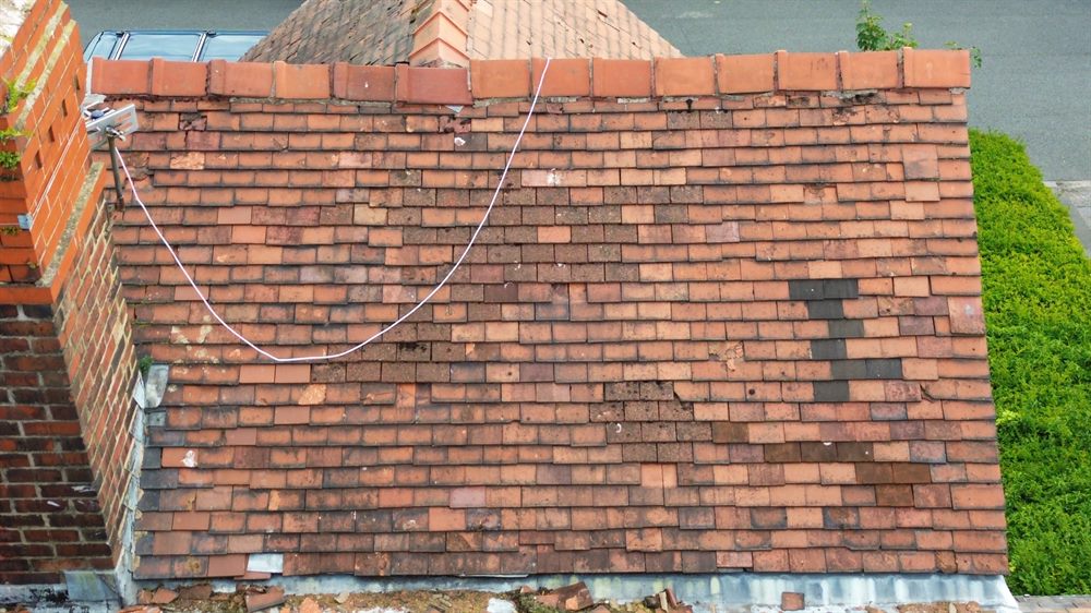 Weathered roof coverings shown as report evidence